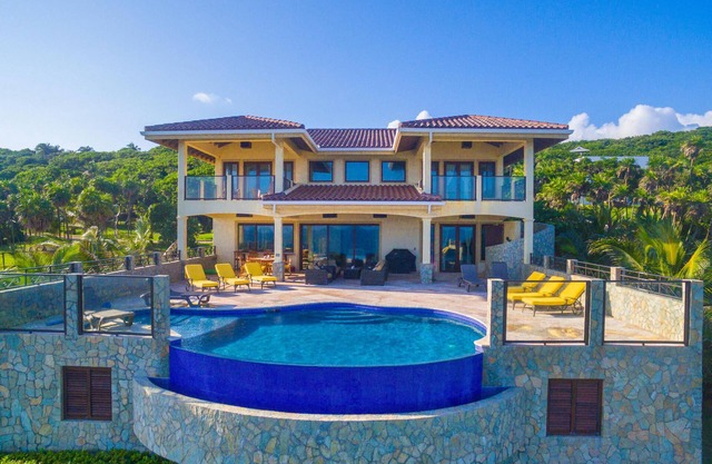 As seen on HGTV! Stunning Luxury Waterfront Home Minutes From West Bay Beach