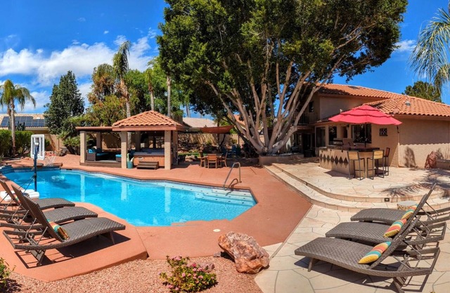 Backyard Oasis + 4 bedrooms. Close to stadium, baseball, golf, shopping