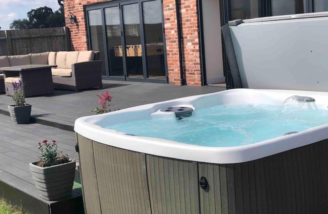 Barn Conversion with Hot Tub & Beautiful Views sleeps 12