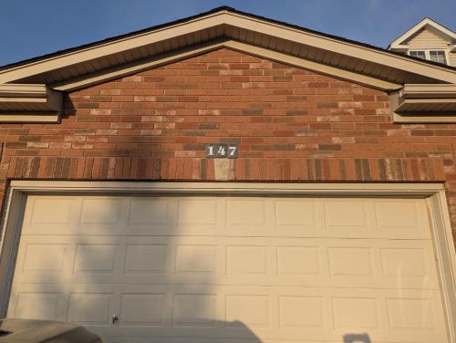 Basement two Queen beds and one single with two full washrooms by YKF airport