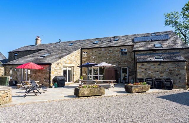 Beautiful old barn converted into holiday accommodation with a woodfired hot tub