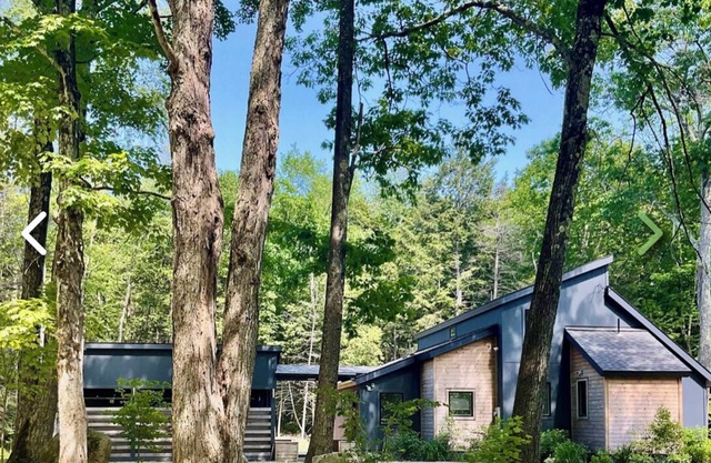 Beautiful, peaceful modern home in a wooded area with town beach lake access