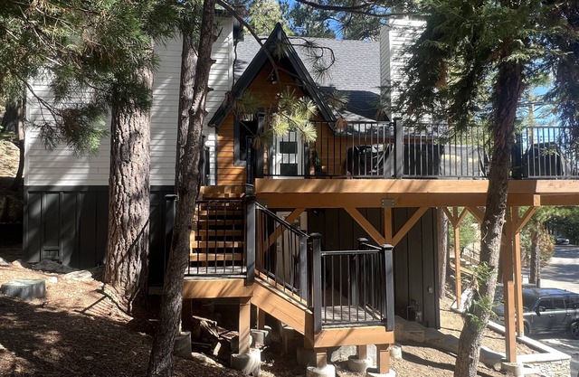 Beautiful updated 3 level home with high ceilings, a wall of windows & game room