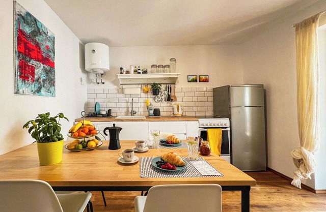 Boho-style apartment with private terrace in old city centre, tailored for 2