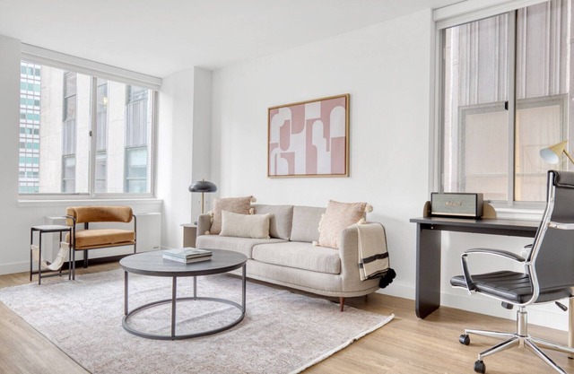 Bright FiDi 1BR w/W/D, Doorman, Elevator & Roof Deck, by Blueground