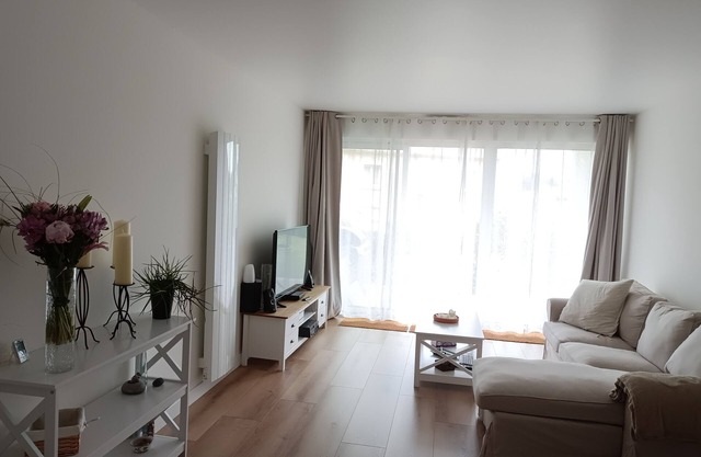 Bright, renovated garden apartment facing the sea.
