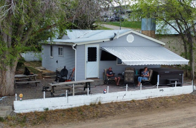 Charming 2 bedroom waterfront cabin at West Magic Id. 83352 with hot tub.