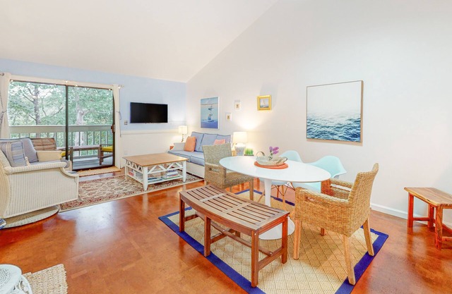 Charming second-floor retreat with a full kitchen and balcony view