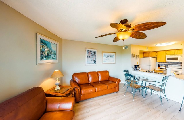 Coastal retreat with private balcony, pool, & easy beach access