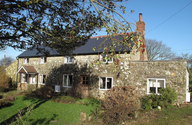 Cottage Set In Rolling Countryside