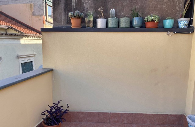 Cozy 2-bedroom house downtown Acitrezza with a picturesque rooftop patio.
