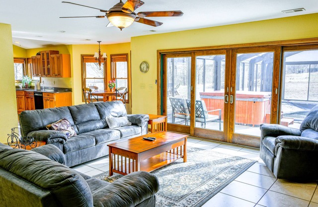 Creek-side home with private hot tub, game room, firepit, deck & mountain view