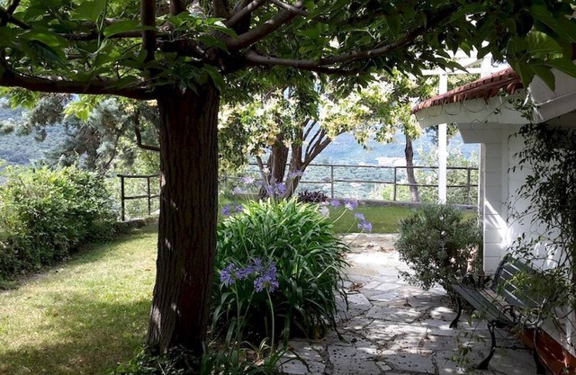 Delightful wooden cottage with dehor and garden surrounded by Ligurian greenery.