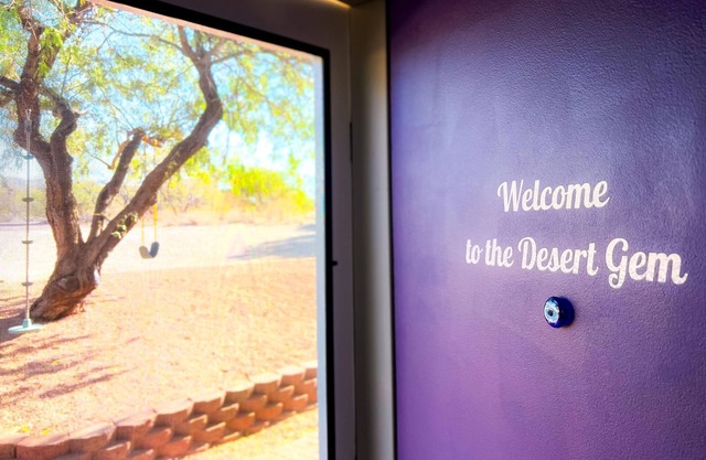 Desert Gem Guest House nestled among lush Mesquite trees.