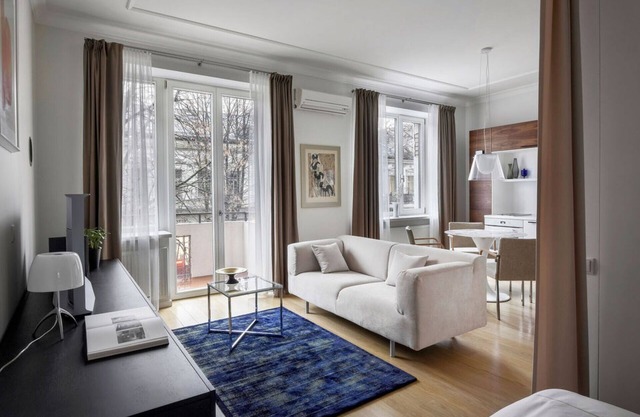 Design Central Studio Apartment with Balcony by Hostlovers