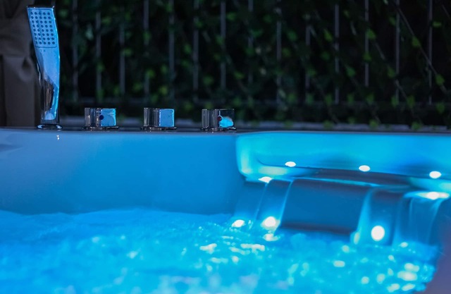 Detached villa with outdoor hot tub, swimming pool and lawn
