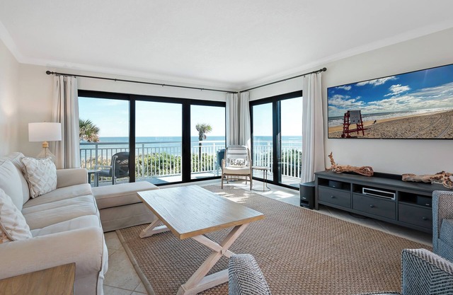 Direct oceanfront corner condo with large wrap-around balcony and heated pool