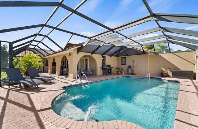 Dog-Friendly Canal-Front Home with Heated Pool, Dock, Screened Lanai & Free WiFi