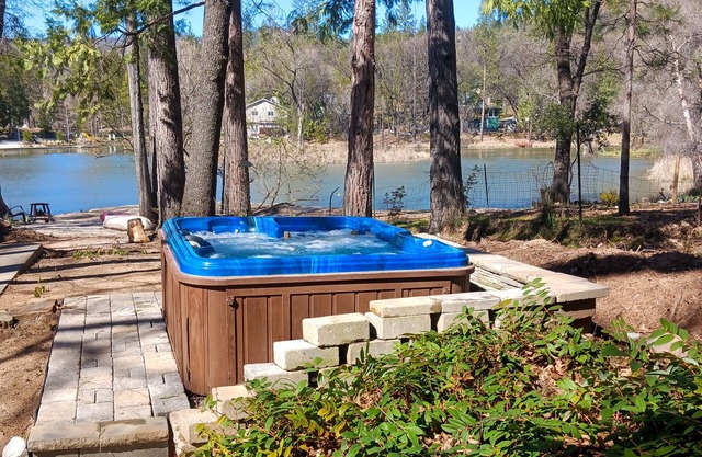 Dog-friendly lakefront cabin with canoes, athletic courts, grill, & horse stable