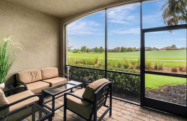 Enjoy views of the immaculate green from your screened lanai at Lakeside National - Golfside Escape