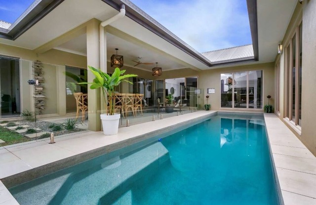 ESCAPADES @ Palm Cove is a luxury house with heated pool