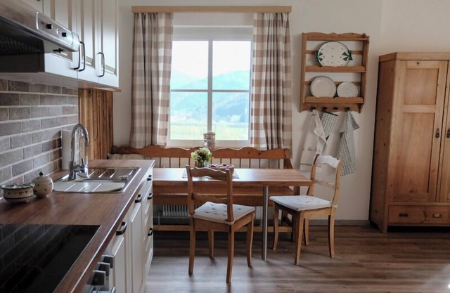 Exclusive country house-style apartment with a free-standing bathtub and a view of the mountains