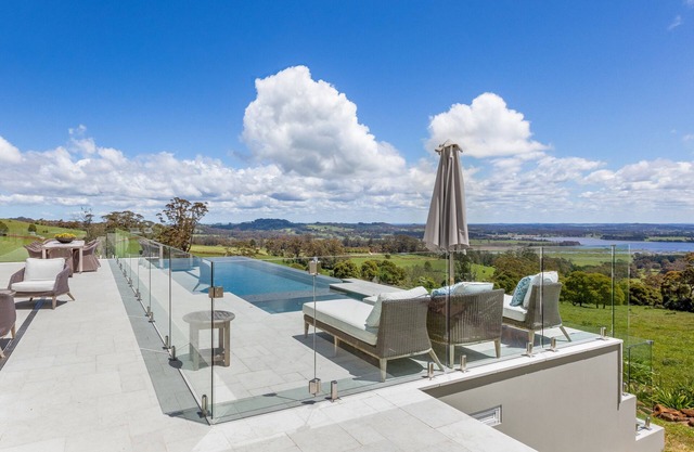Expansive Hamptons home on acreage, with pool, spa, gym, tennis court & views.