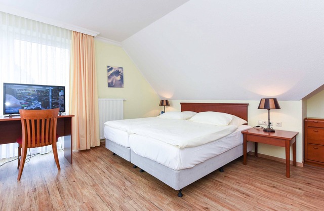 Familienzimmer im Obergeschoss - Familienzimmer im Obergeschoss im Hotel Benser Watt