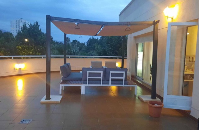 First line beach apartment with large terrace, communal pool and garage
