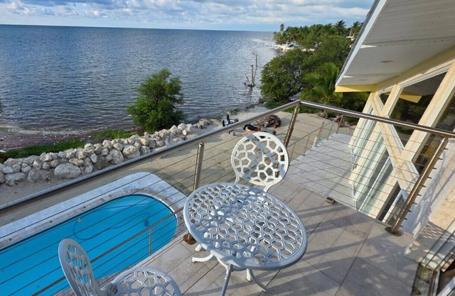 Four-bedroom beach house with oceanfront pool and smokeless bonfire area