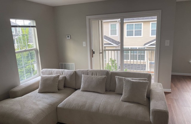 Fully furnished room in sun-drenched condo. 7 minute walk to Wheaton metro.