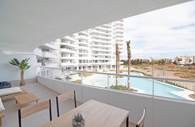 Global Properties: Apartment with terrace and pool views in Gran Canet