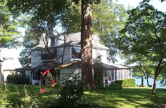 Gorgeous Sandy Beachfront Paw Paw lake home with 155 ft. of frontage and dock