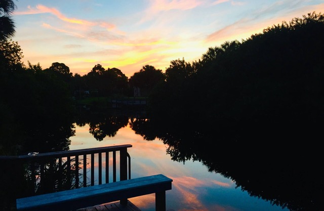Great waterfront property with private dock, pool and tiki bar!