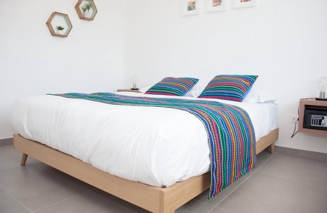 Green apartment with double bedroom and living room / kitchen with sofa bed and private bathroom