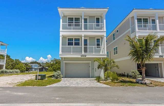 Green Home with Private Dock and Tesla Charger - Only Sunsets at Hunter's Point