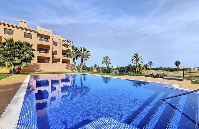 Ground floor with pool and golf views