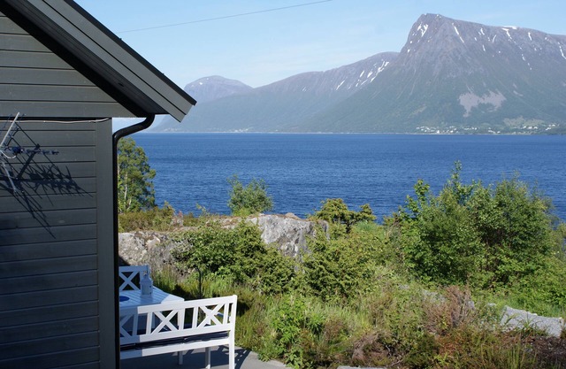 Holiday home with view plot beyond Fjord and mountains.