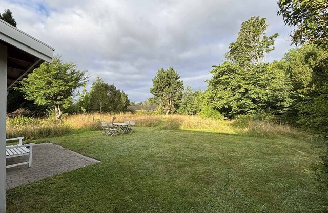 Holiday home with natural plot near beach, hills