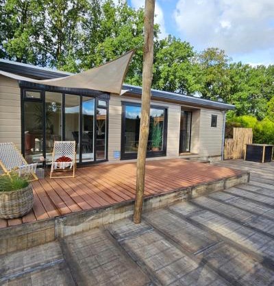 Holiday house with private SAUNA and HOTTUB on park de Ijsvogel with swimming pools and children entertaiment AIRCO