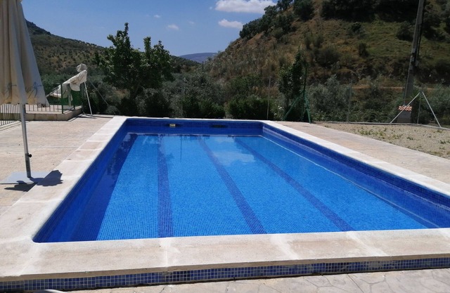 Large house located in an olive grove, near the river Caicena.