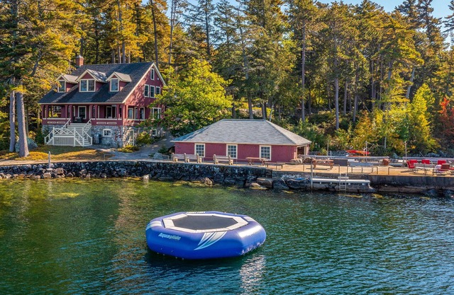 Large lakefront property with boat slip, gym, washer/dryer, central AC & firepit