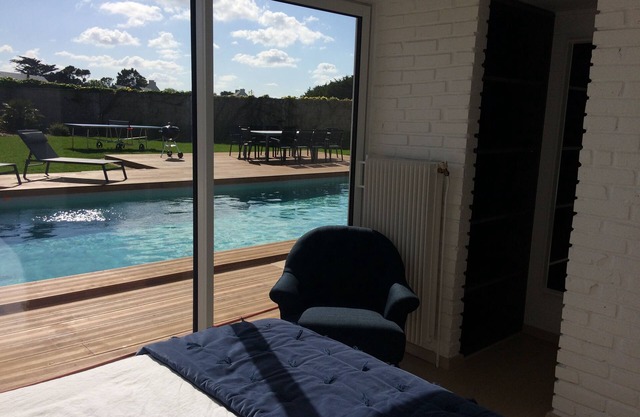 "LES EMBRUNS villa, feet in the water" and heated swimming pool