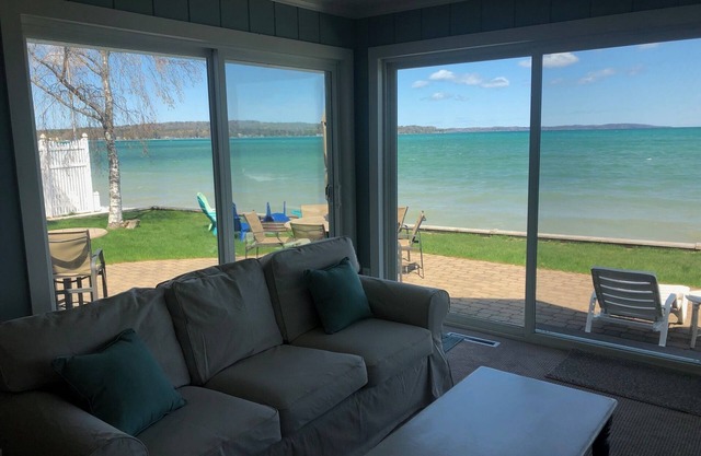 Located directly on East Grand Traverse Bay with sandy beach