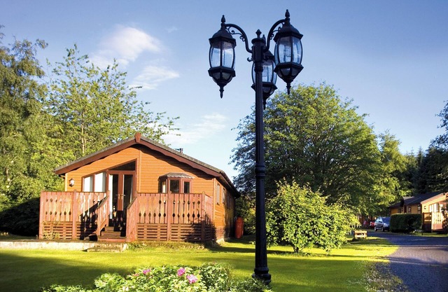 Log cabin with one double with en suite shower and two twin.