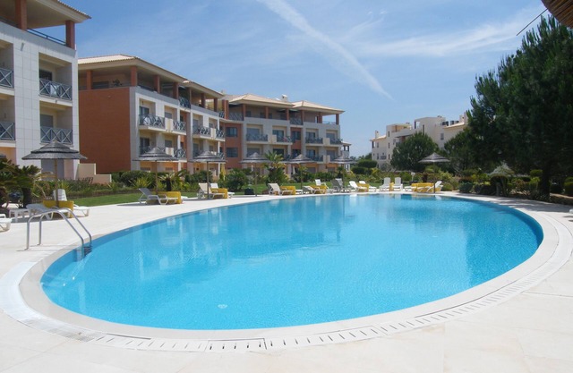 Luxurious spacious apartment with balconies overlooking pool & gardens A/C Wifi