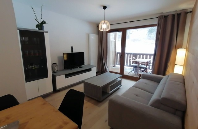 Luxury apartment at the foot of the slopes with parking and wellness area