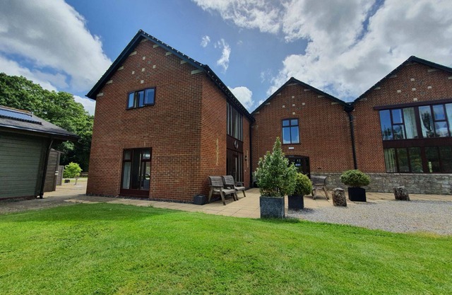 Luxury barn conversion sleeping 16 with hot tub and ensuite bedrooms