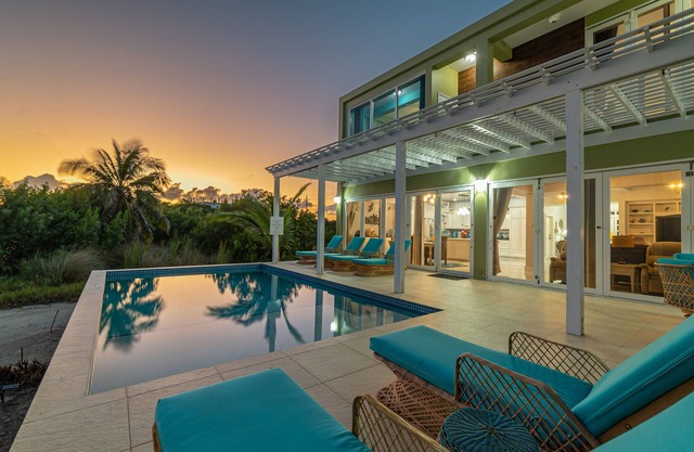 Luxury Oasis: Serene Beachfront with Pool & Dock