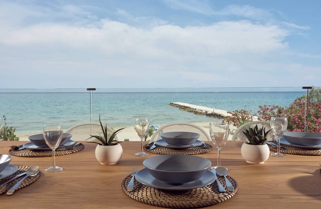 Maritimus Excelsior Suites 2 right onto sandy Alykes Beach